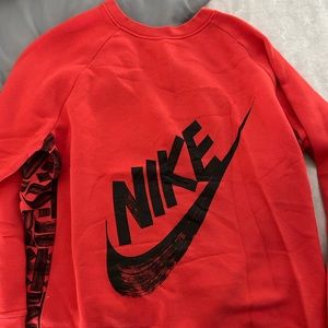 Red Nike Sweatshirt.  Black design.